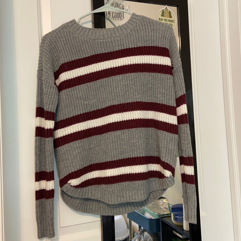 So striped red, white, and grey sweater